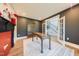 Spacious home office featuring hardwood floors, a fireplace, and ample storage with a neutral color palette at 3624 Regent Pines Dr, New Hill, NC 27562
