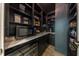 Well-organized, dark pantry with modern microwave and wine fridge for ultimate convenience at 3624 Regent Pines Dr, New Hill, NC 27562