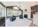 Bright sun room featuring lots of natural light, modern fireplace and comfortable seating at 3624 Regent Pines Dr, New Hill, NC 27562