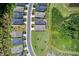 Aerial view of several homes in a residential neighborhood with manicured lawns and landscaping at 365 Middleton Pl, Chapel Hill, NC 27516