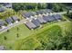 Aerial view of a residential neighborhood showcasing well-maintained homes, lawns, and landscaping at 365 Middleton Pl, Chapel Hill, NC 27516