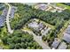 Aerial view of the community pool and clubhouse surrounded by trees at 365 Middleton Pl, Chapel Hill, NC 27516