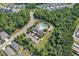 Aerial view of the community pool and clubhouse surrounded by trees at 365 Middleton Pl, Chapel Hill, NC 27516