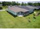 Aerial view of a home with a screened porch, a spacious backyard and manicured lawn at 365 Middleton Pl, Chapel Hill, NC 27516