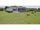 Large backyard with a screened porch, patio furniture, manicured lawn, and fresh landscaping at 365 Middleton Pl, Chapel Hill, NC 27516