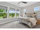 Calm bedroom features lots of light from big windows and modern rustic furniture at 365 Middleton Pl, Chapel Hill, NC 27516