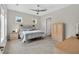 Comfortable bedroom features lots of light from big windows and modern rustic furniture at 365 Middleton Pl, Chapel Hill, NC 27516