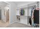 Spacious closet featuring built-in shelving for clothes and shoes with the Primary shower just outside the door at 365 Middleton Pl, Chapel Hill, NC 27516