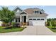 Inviting home exterior showcasing well-maintained landscaping, stone pillars, and a two-car garage at 365 Middleton Pl, Chapel Hill, NC 27516