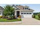 Charming exterior view with a white garage door, complemented by stone accents at 365 Middleton Pl, Chapel Hill, NC 27516