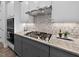 Well-equipped kitchen offering stainless steel appliances, a gas cooktop, and decorative backsplash at 365 Middleton Pl, Chapel Hill, NC 27516