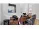 Home office with wood desk, shelving, ergonomic chair, and modern office equipment and decor at 365 Middleton Pl, Chapel Hill, NC 27516