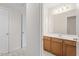 Bathroom with wood cabinets and a large vanity at 3812 Covina Dr, Raleigh, NC 27613