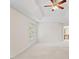 Large bedroom with ceiling fan and trey ceiling features neutral carpet and an attached bath at 3812 Covina Dr, Raleigh, NC 27613