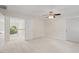 Large bedroom with neutral carpet, white trim, and view to second story landing through door opening at 3812 Covina Dr, Raleigh, NC 27613