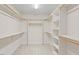 Walk-in closet features built-in shelving and ample storage space at 3812 Covina Dr, Raleigh, NC 27613