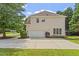 Charming home with a two-car garage, well-manicured lawn, and neatly trimmed bushes enhancing its curb appeal at 3812 Covina Dr, Raleigh, NC 27613