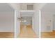 Bright foyer featuring gleaming hardwood floors and a view of the upper level at 3812 Covina Dr, Raleigh, NC 27613