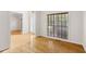 Sun-drenched living area with gleaming hardwood floors and neutral paint at 3812 Covina Dr, Raleigh, NC 27613