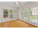 Bright sunroom with hardwood floors and many windows at 3812 Covina Dr, Raleigh, NC 27613