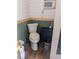 Small bathroom featuring a toilet, cabinet, and wood flooring at 4008 Old Nc 86, Hillsborough, NC 27278