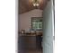 A kitchenette with wood countertops, cabinets, sink, window, and wooden ceiling at 4008 Old Nc 86, Hillsborough, NC 27278