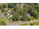 An aerial view of a home in a neighborhood with mature trees and landscaping at 403 Carpenter Fletcher Rd, Durham, NC 27713