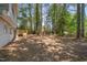 Expansive backyard with trees, offering a private and natural setting for outdoor enjoyment at 403 Carpenter Fletcher Rd, Durham, NC 27713