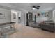 Finished basement with a gray sofa, entertainment center, and game table at 403 Carpenter Fletcher Rd, Durham, NC 27713