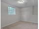 Comfortable bedroom with natural light and neutral carpet, creating a cozy and relaxing space at 403 Carpenter Fletcher Rd, Durham, NC 27713