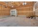 Unfinished garage with shelving, providing ample space for storage and customization at 403 Carpenter Fletcher Rd, Durham, NC 27713
