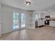 Gourmet kitchen with stainless steel appliances, white cabinets, and plenty of counter space at 403 Carpenter Fletcher Rd, Durham, NC 27713