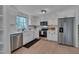 Modern kitchen with stainless steel appliances, white cabinets, and beautiful countertops at 403 Carpenter Fletcher Rd, Durham, NC 27713