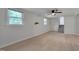 Inviting living room with windows and light-colored floors, creating a bright and airy space at 403 Carpenter Fletcher Rd, Durham, NC 27713