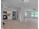 Bright living room featuring stainless steel appliances and light colored wood flooring at 403 Carpenter Fletcher Rd, Durham, NC 27713