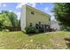 Spacious backyard with patio, outdoor seating, and lush green lawn for relaxing or entertaining at 404 Blooming Meadows Rd, Holly Springs, NC 27540