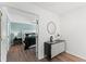 A serene bedroom featuring a decorative black cabinet, hardwood floors, and soothing wall color at 404 Blooming Meadows Rd, Holly Springs, NC 27540