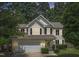 Beautiful two-story home featuring a classic design, well-maintained yard, and attached garage at 404 Blooming Meadows Rd, Holly Springs, NC 27540
