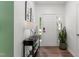 Inviting foyer with modern decor, a console table, and ample natural light through the front door windows at 404 Blooming Meadows Rd, Holly Springs, NC 27540