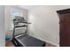 This home features a personal gym with a modern treadmill and hardwood flooring at 404 Blooming Meadows Rd, Holly Springs, NC 27540
