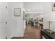 Open-concept kitchen and dining area with an island, stainless steel appliances, wood floors, and seamless flow at 404 Blooming Meadows Rd, Holly Springs, NC 27540
