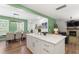 Spacious open concept kitchen with a large island and a view of the dining and living areas, ideal for entertaining at 404 Blooming Meadows Rd, Holly Springs, NC 27540
