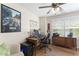 Well-lit office space with wooden desk, sleek chair, and organized storage solutions at 404 Blooming Meadows Rd, Holly Springs, NC 27540
