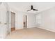 Bright bedroom with neutral carpet, ceiling fan, and natural light at 4060 Barton Park Pl, Raleigh, NC 27613