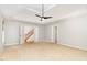 Large bedroom with hardwood stairs and carpet at 4060 Barton Park Pl, Raleigh, NC 27613