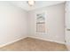 Cozy bedroom with neutral carpet, window, and natural light at 4060 Barton Park Pl, Raleigh, NC 27613