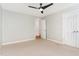 Simple bedroom with neutral carpet, ceiling fan, and neutral walls for a cozy atmosphere at 4060 Barton Park Pl, Raleigh, NC 27613
