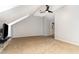 Neutral-toned bonus room features carpet, a ceiling fan and an attached bathroom at 4060 Barton Park Pl, Raleigh, NC 27613