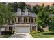 Charming brick townhome featuring a two-car garage and well-maintained landscaping in a desirable neighborhood at 4060 Barton Park Pl, Raleigh, NC 27613