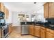 Updated kitchen with stainless steel appliances, granite counters, and a view to a living area at 4060 Barton Park Pl, Raleigh, NC 27613
